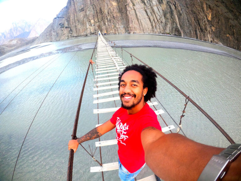 Man crossing the husseini bridge in Pakistan