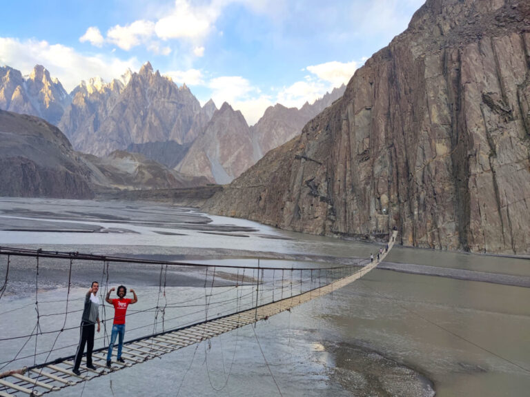 Men crossing the Husseini bridge in Pakistan