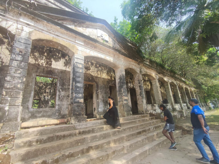 People exploring the Paricatuba ruins in the Amazon