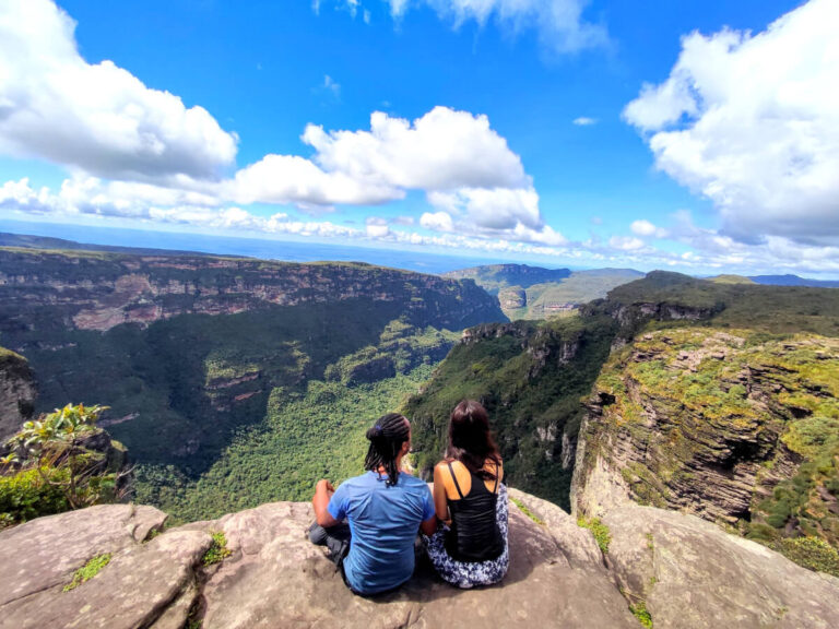 Couple sitting near the top of the Fumaca waterfall