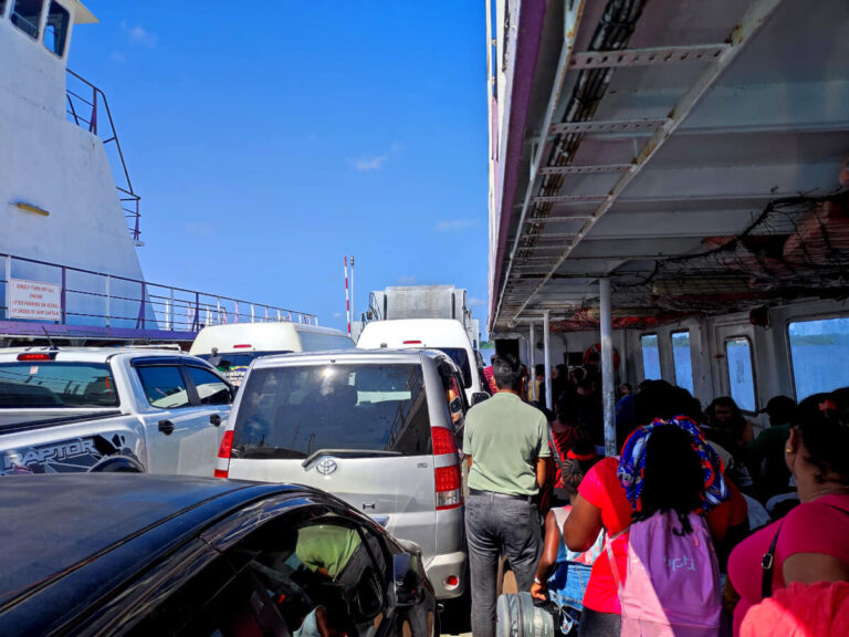 People crossing the river from Suriname to Guyana