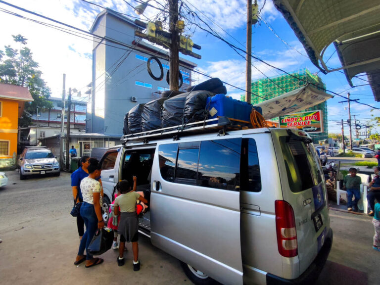 People packing their bags inside a var in Georgetown, Guyana