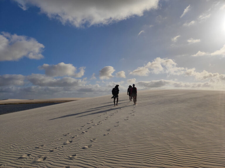 People walking in the Lencois Maranhenses National Park in Brazil