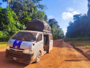 Van covered with dust on the road between Georgetown and Lethem