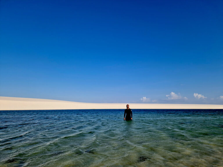 Man in one of the several lakes in the Lencois Maranhenses National Park in Brazil