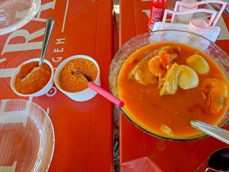 Brazilian moqueca with seafood, eggs, farinha and pirao