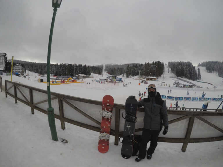 Man standing in front of the man entrance of the Kopaonik Ski Resort