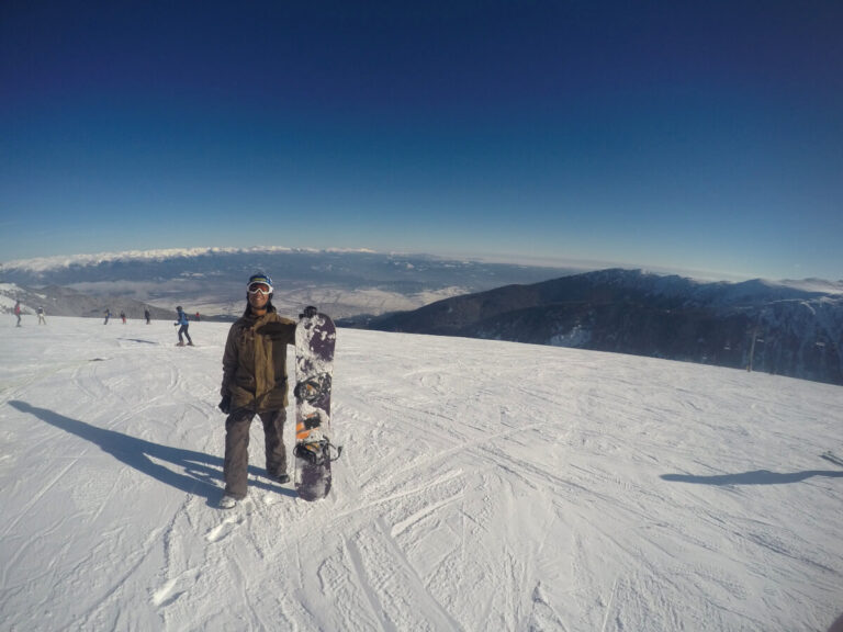 Man snowboarding in Bansko, Bulgaria