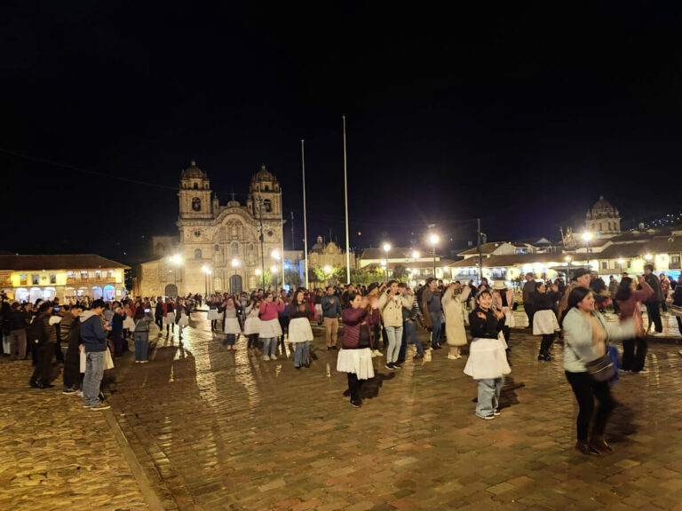 A group of peruvians dancing in the city center of Cusco