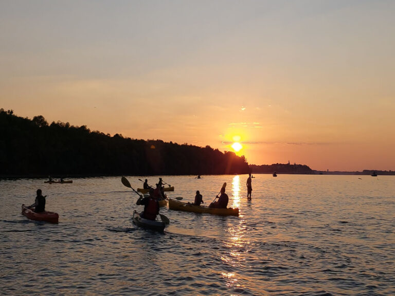 People kayaking on the Danube river in Belgrade