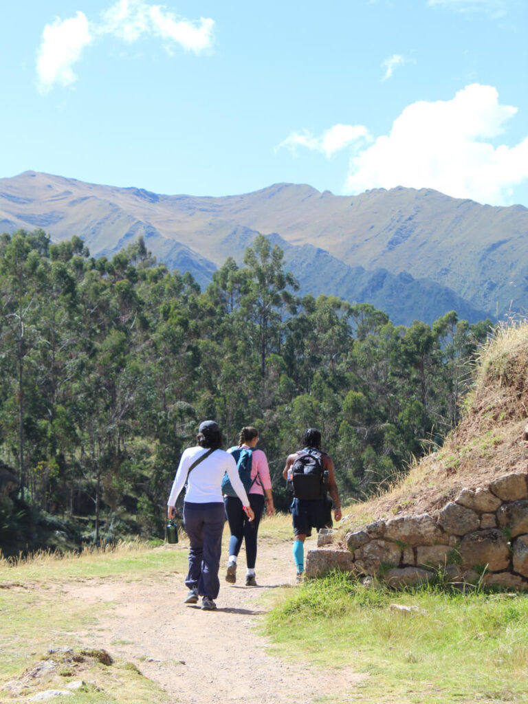 People hiking in Chinchero, part of a 3-week peru itinerary